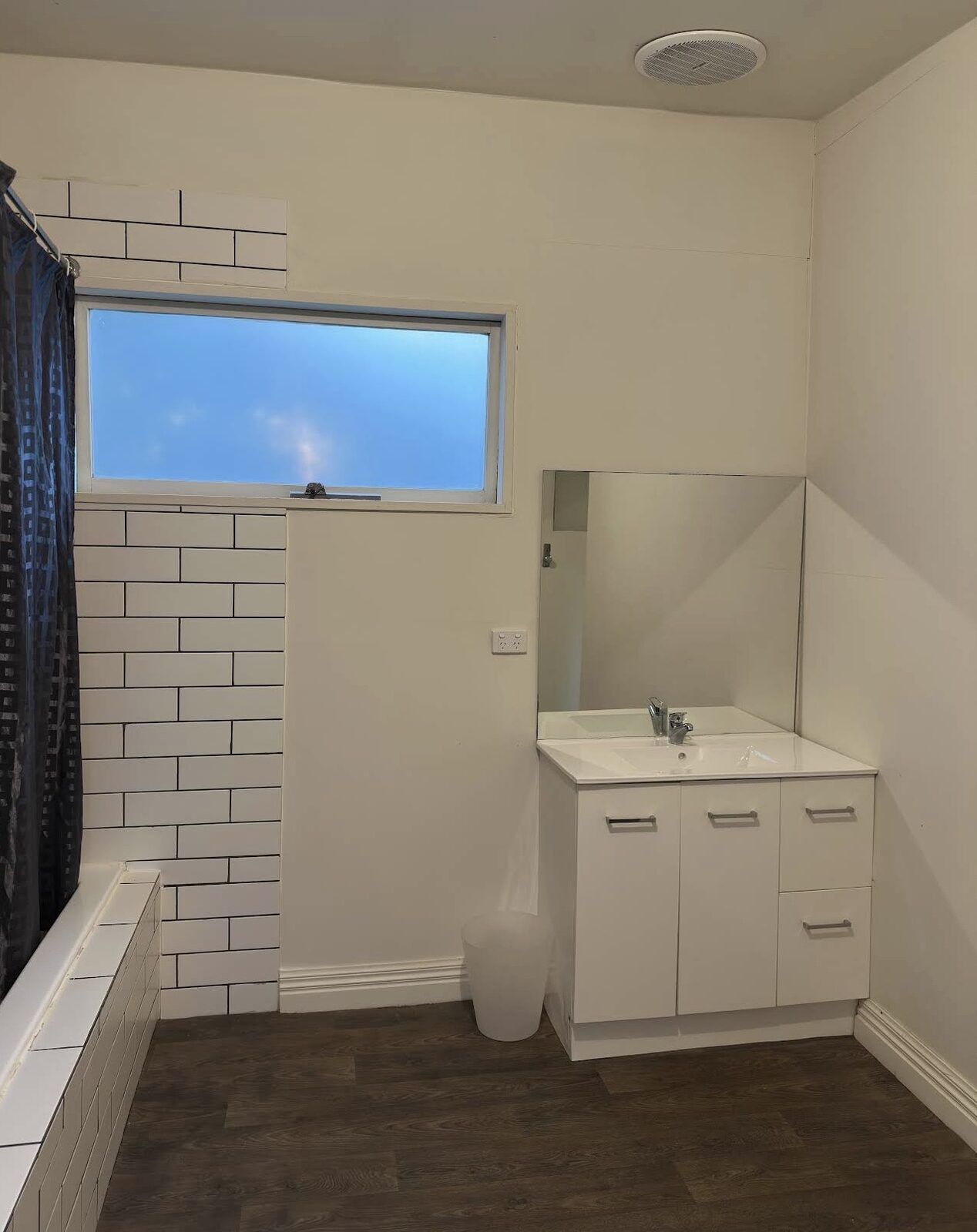 Clean bathroom vanity, tiles and window